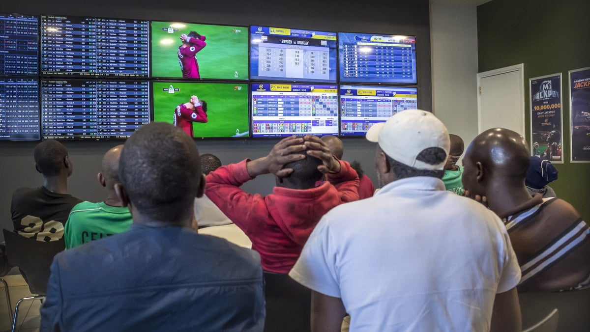 Nigerians at a sports betting shop
