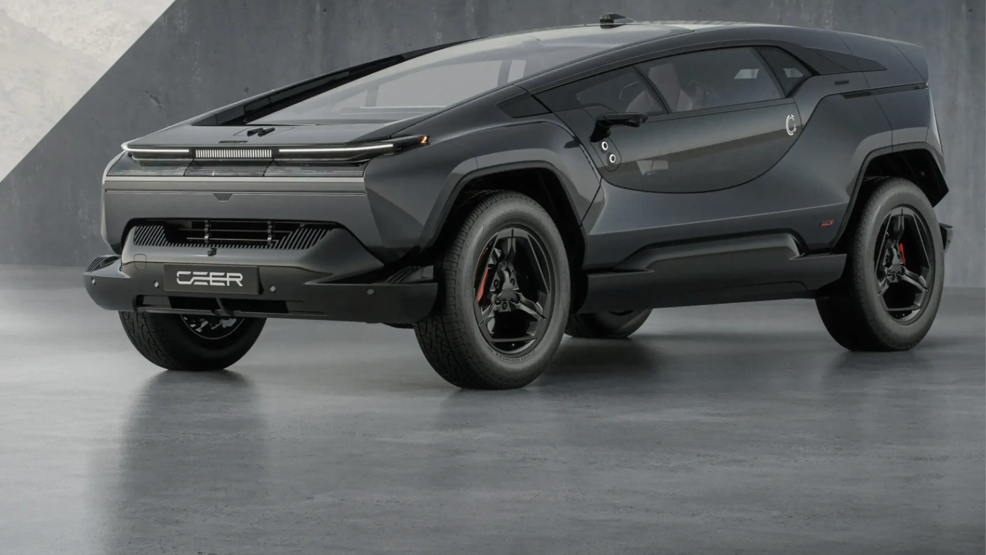 A modern, sporty black vehicle with a sleek design and distinctive wheel rims, showcased in a minimalist setting